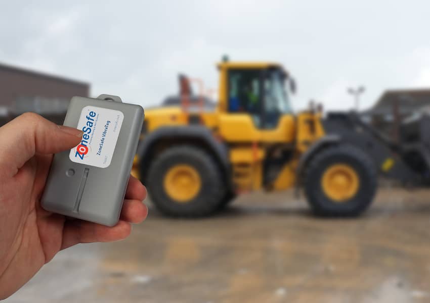hand-holding-zonesafe-tag-infront-of-shovel-loader-waste-management-health-and-safety